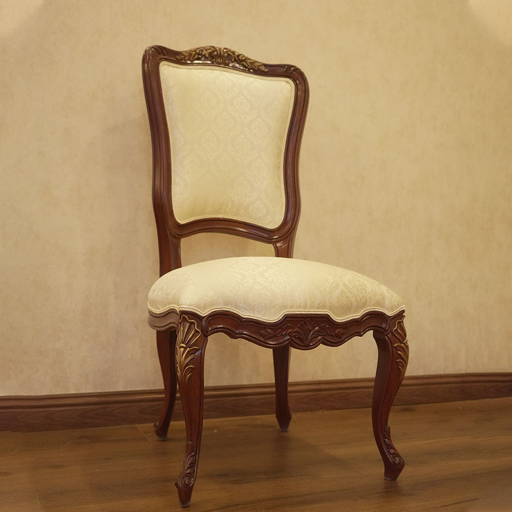 Elegant Carved Wood Dining Chair with Cream Upholstery