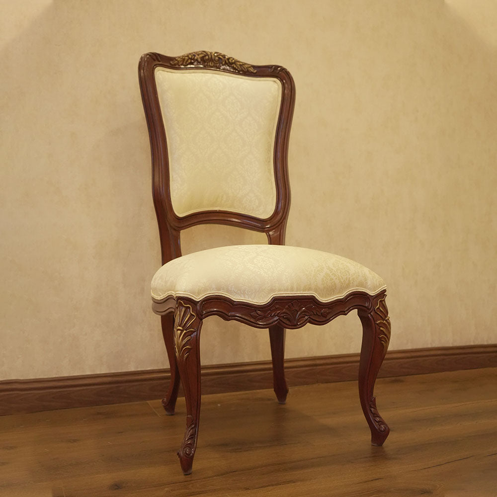 Elegant Carved Wood Dining Chair with Cream Upholstery