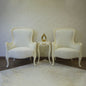 Elegant Ivory High-Back Accent Chair Pair with Decorative Side Table