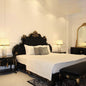 Luxurious Black Velvet Tufted King Bed with Gold Carved Details